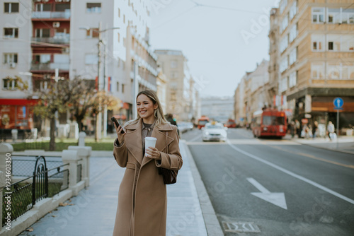 Woman smiles while walking ...