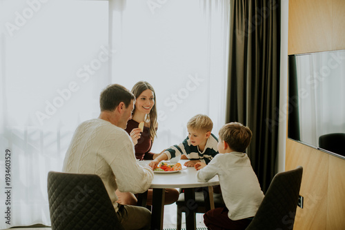 Family shares a meal togeth...