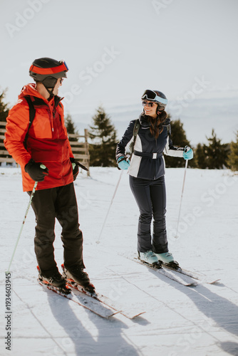 Couple enjoys skiing at sno...