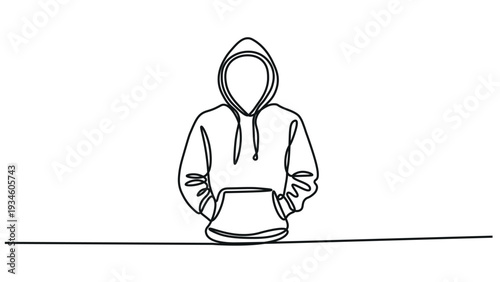 A person wearing a hoodie with their hands in their pockets