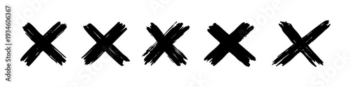 Set of hand-drawn black grunge cross symbols isolated on a white background. Textured ink 'X' marks for delete, error, or reject concepts.