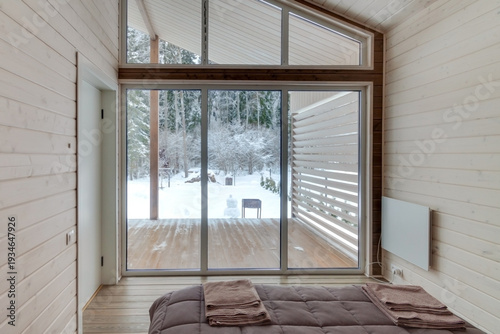 Cozy Bedroom with Winter Forest View