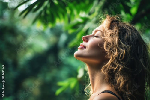 Woman enjoying nature with greenery in the background