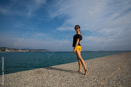 girl against the backdrop of the sea