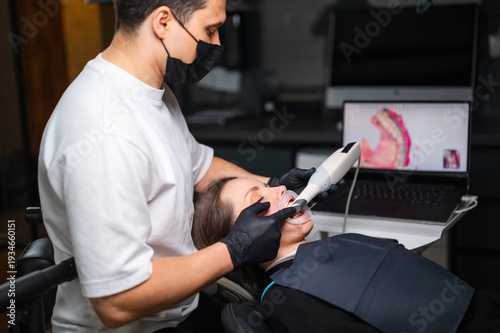Capture Of Digital Impressions With Intraoral Scanner Displayed On Laptop For Restoration Planning