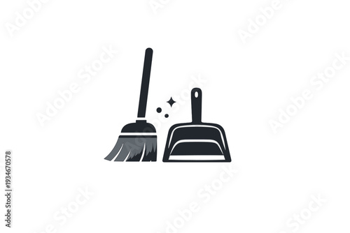 Cleaning tools with broom and dustpan used for tidying up spaces in