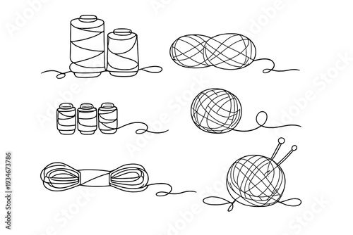 Various thread spools and yarn balls arranged in a simple layout