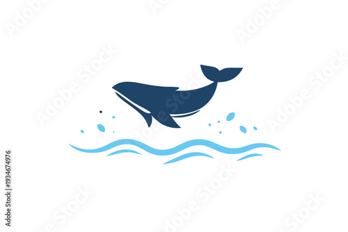 Whale breaches the surface of the ocean during a sunny day while