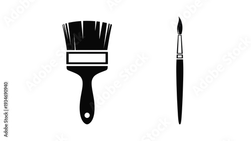 Two paintbrushes in a striking black silhouette