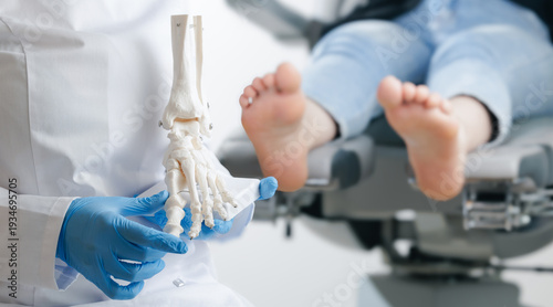 Tableau sur toile Podiatrist consulting caucasian female adult with anatomical foot model