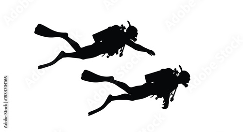 Silhouettes of two scuba divers swimming underwater in a dynamic pose