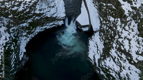 Aerial drone clip over and evergreen forest and river in the American West.