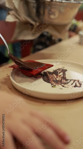 Pouring melted chocolate into heart mold