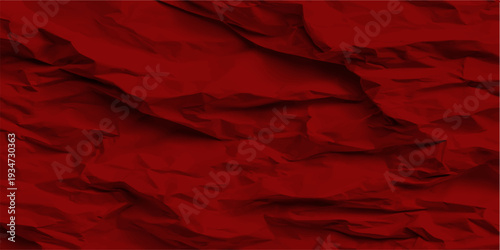 A closeup of red crumpled paper reveals a grunge textured pattern with a soft silk-like design, creating a blank velvet material backdrop for art and wallpaper