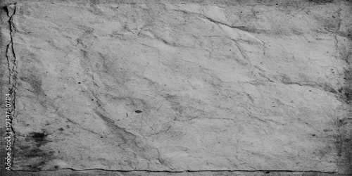 Aged grunge concrete wall texture featuring a cracked stone surface with a dirty cement pattern and ancient rock material for a rough brown industrial background