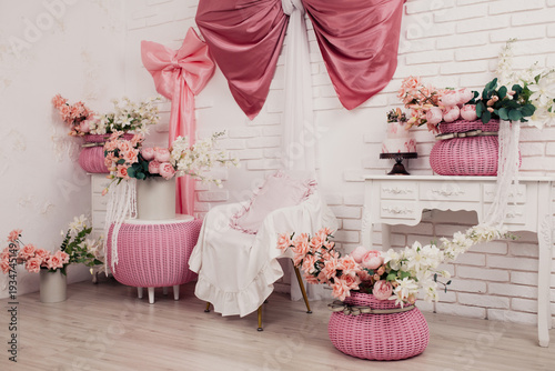the interior of the room of a teenage girl who loves pink and fluffy bows. Flower vases made of environmentally friendly plastic, wooden dressers with aristocratic moldings