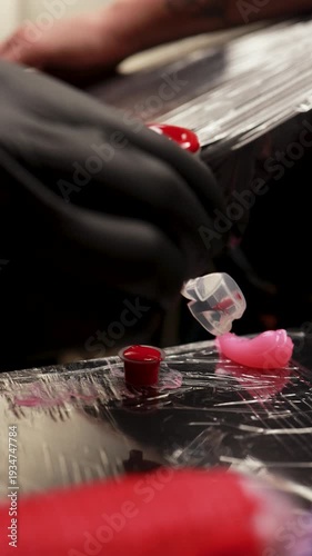 Tattoo ink caps and pink pigment setup