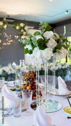 Tall white rose centerpiece with hanging pearls