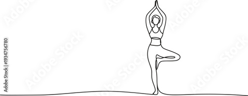 A serene woman stands gracefully in a balanced tree yoga pose.