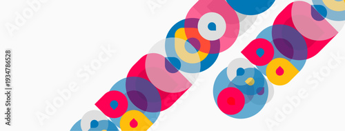 Abstract colorful circles overlap, creating dynamic diagonal pattern. Bright hues contrast against white background. Modern design element.
