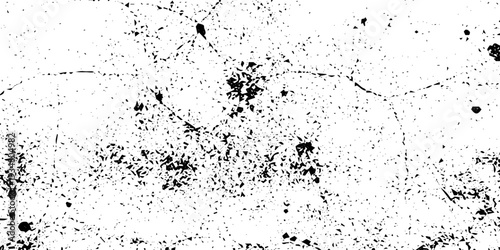 Abstract Grunge Dust and Scratch Overlay Texture in Black and White with Speckles, Paint Droplets, Film Grain Noise and Distressed Paper Background for Vintage Style Graphic Design Use