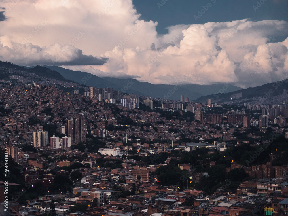 Naklejka premium Dramatic storm clouds forming above Medellín city landscape