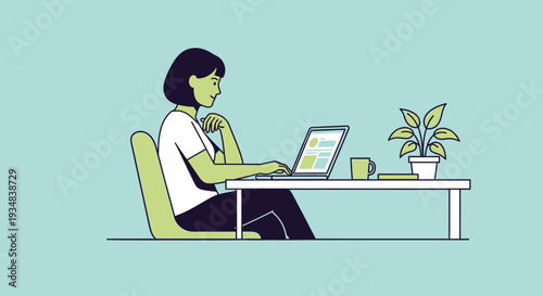 Woman sitting at desk working on laptop with plant nearby indoor