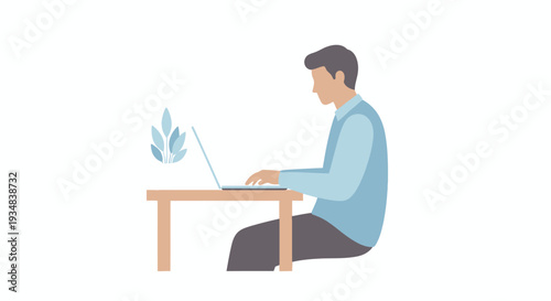 Man sitting at desk working on laptop with plant nearby indoors