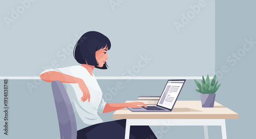 A woman sits at a desk using a laptop with a plant nearby indoors.