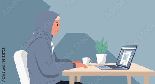 Woman sitting at desk working on laptop with plant and coffee
