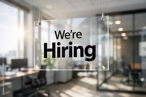 Wallpaper Mural Glass sign with 'we're hiring' in modern office background with blurred desks and windows Torontodigital.ca