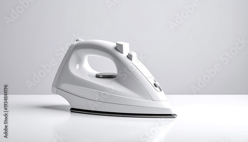 White electric iron on a white surface