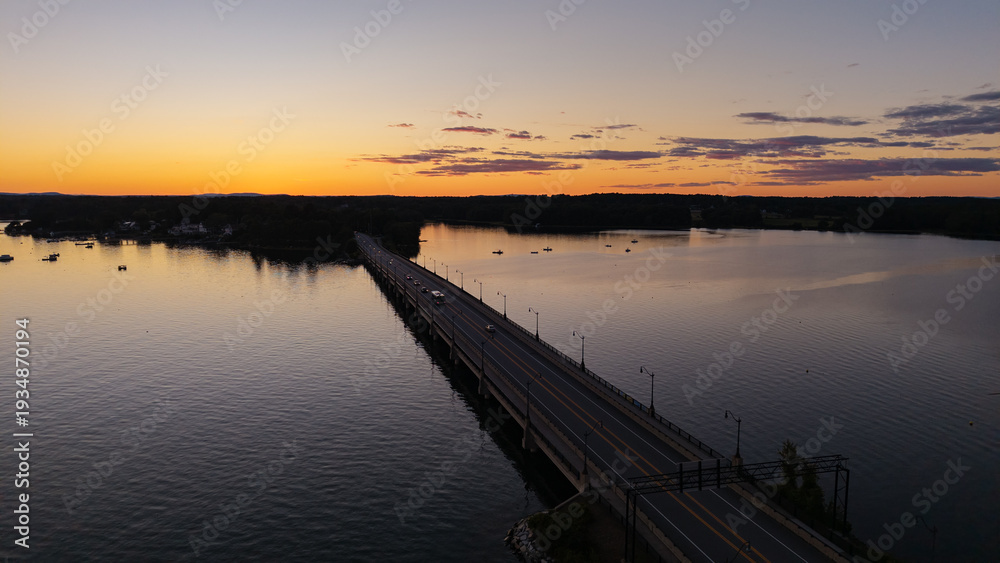 Obraz premium Sunset aerial View of the Great Bay at the Scammell Bridge in New Hampshire
