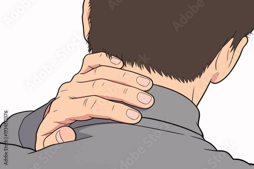A man grips the back of his neck with one hand in an office. He shows signs of discomfort. The setting is bright and typical for work.