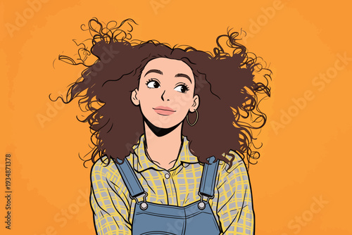 A woman with curly hair smiles while wearing a checkered shirt and denim overalls on a bright orange background.