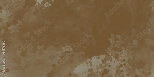 Brown watercolor paint splatters on textured paper
