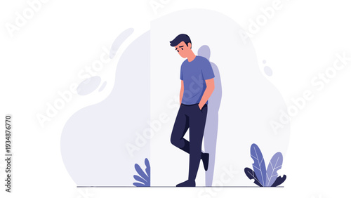 Sad and lonely man in a blue shirt leans against a white wall and looks down in a moment of deep reflection or sorrow.