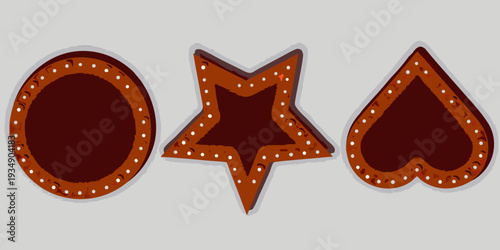 Three gingerbread cookies in circle star and heart shapes