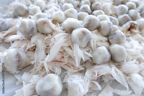 Khanom Tom is a traditional Thai dessert made from glutinous rice flour, filled with grated coconut stir-fried with palm sugar.