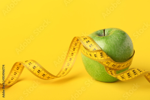 Green apple with measuring ...