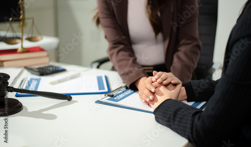 Compassionate lawyer providing legal consultation and emotional support to client, concept of dispute resolution, corporate law, contract advice