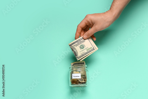 Female hand putting money i...