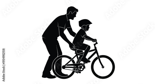Loving father teaches his young child to ride a bicycle for the first time, fostering independence during this important developmental learning moment outdoors.
