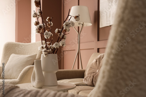 Vases with cotton flowers o...