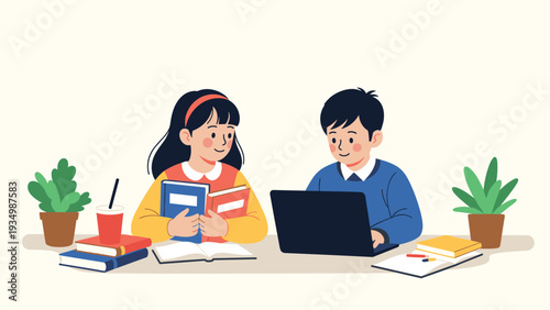 Young students are sitting at a desk together while using a laptop and reading books to study for their school exams.
