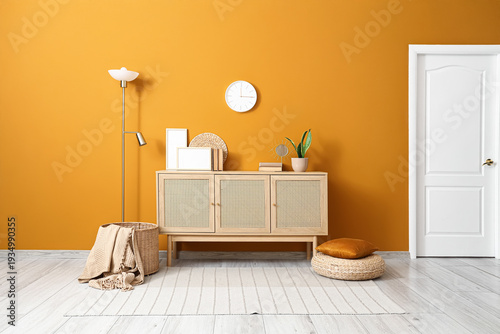Tableau sur toile Interior of stylish room with clock, commode and lamp