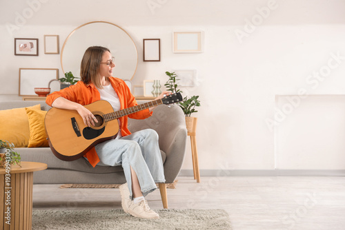 Happy young woman playing g...
