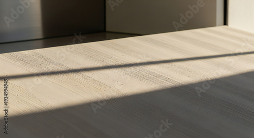 Modern wooden surface with natural light and shadows