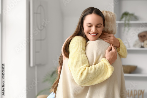 Young woman hugging her gra...
