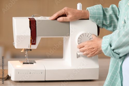 Senior woman adjusting stit...